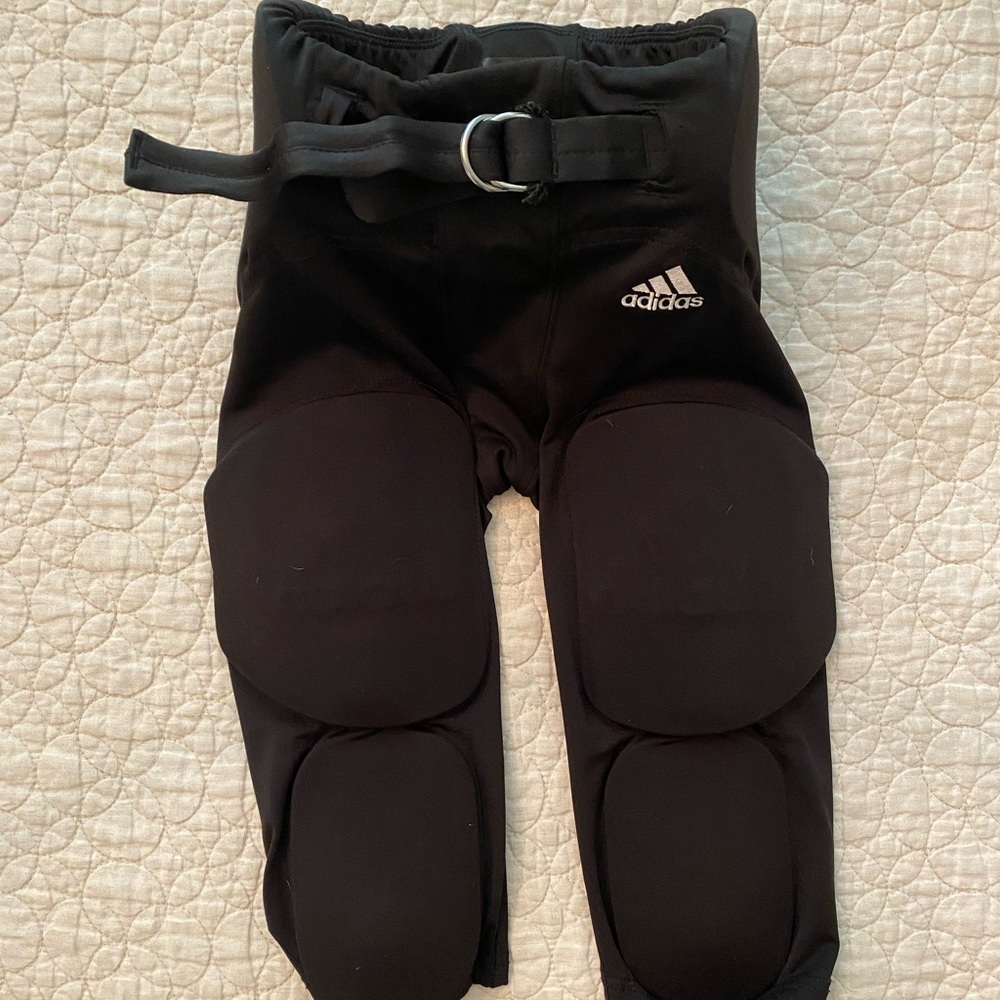 Adidas Youth Med Football Padded Pants.  Adjustable waist. Very Good condition.